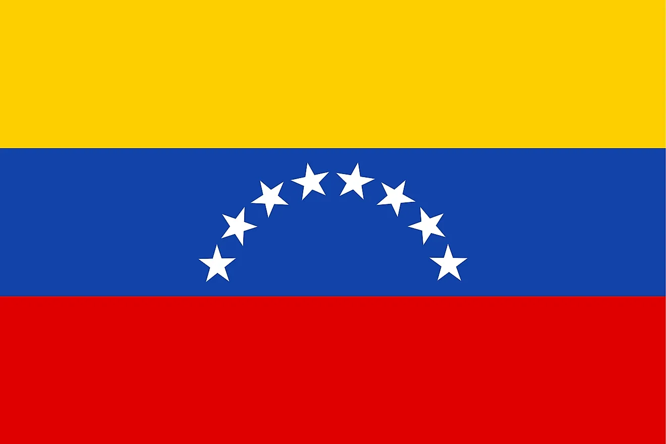 The National Flag of Venezuela featured three equal horizontal bands of yellow (top), blue, and red; with the coat of arms on the hoist side of the yellow band and an arc of eight white five-pointed stars centered in the blue band. 